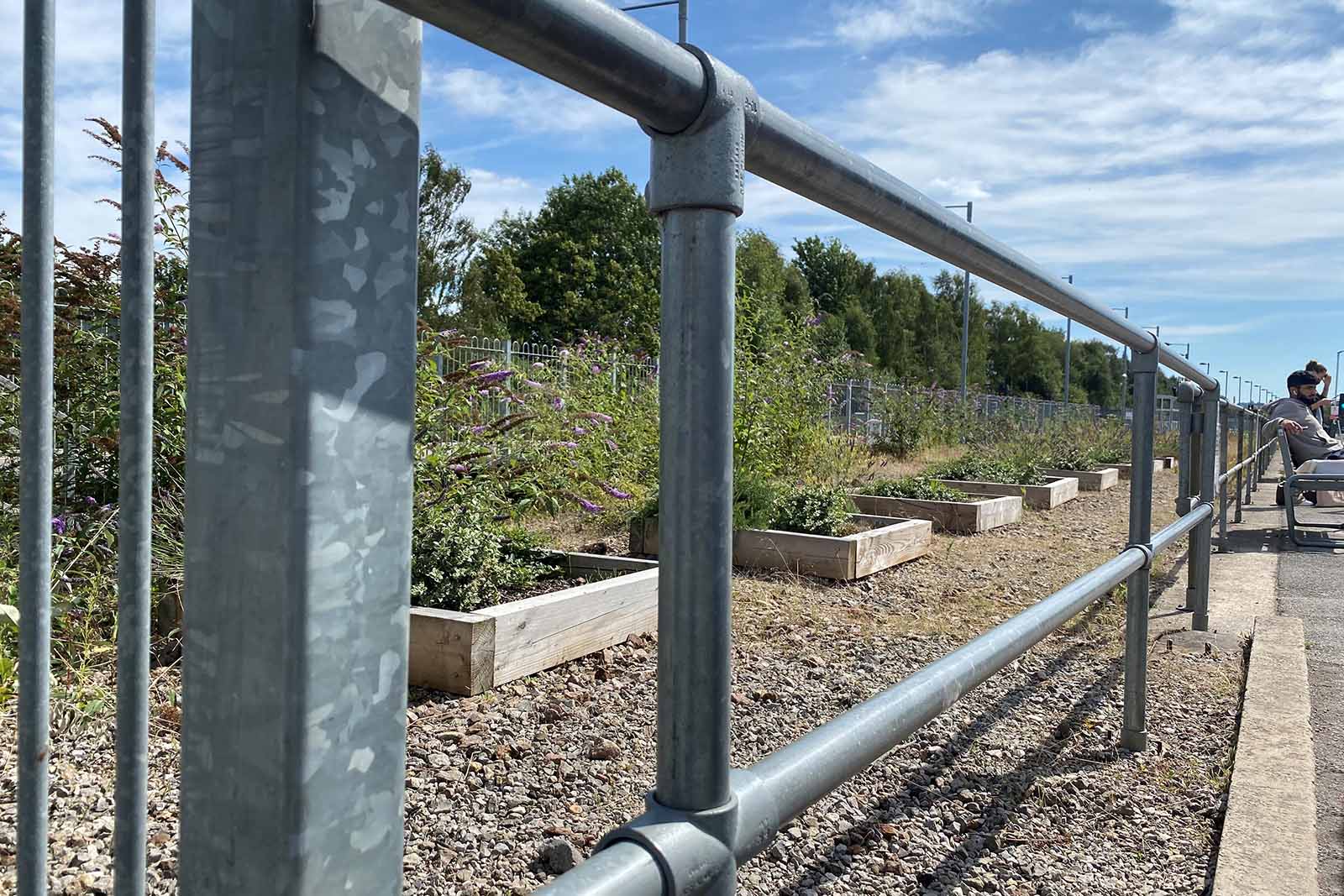 Galvanised safety railing on rail platform